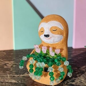 Cute Tan Sloth Figurine with Green Bead Garland and Pink Flower Accents